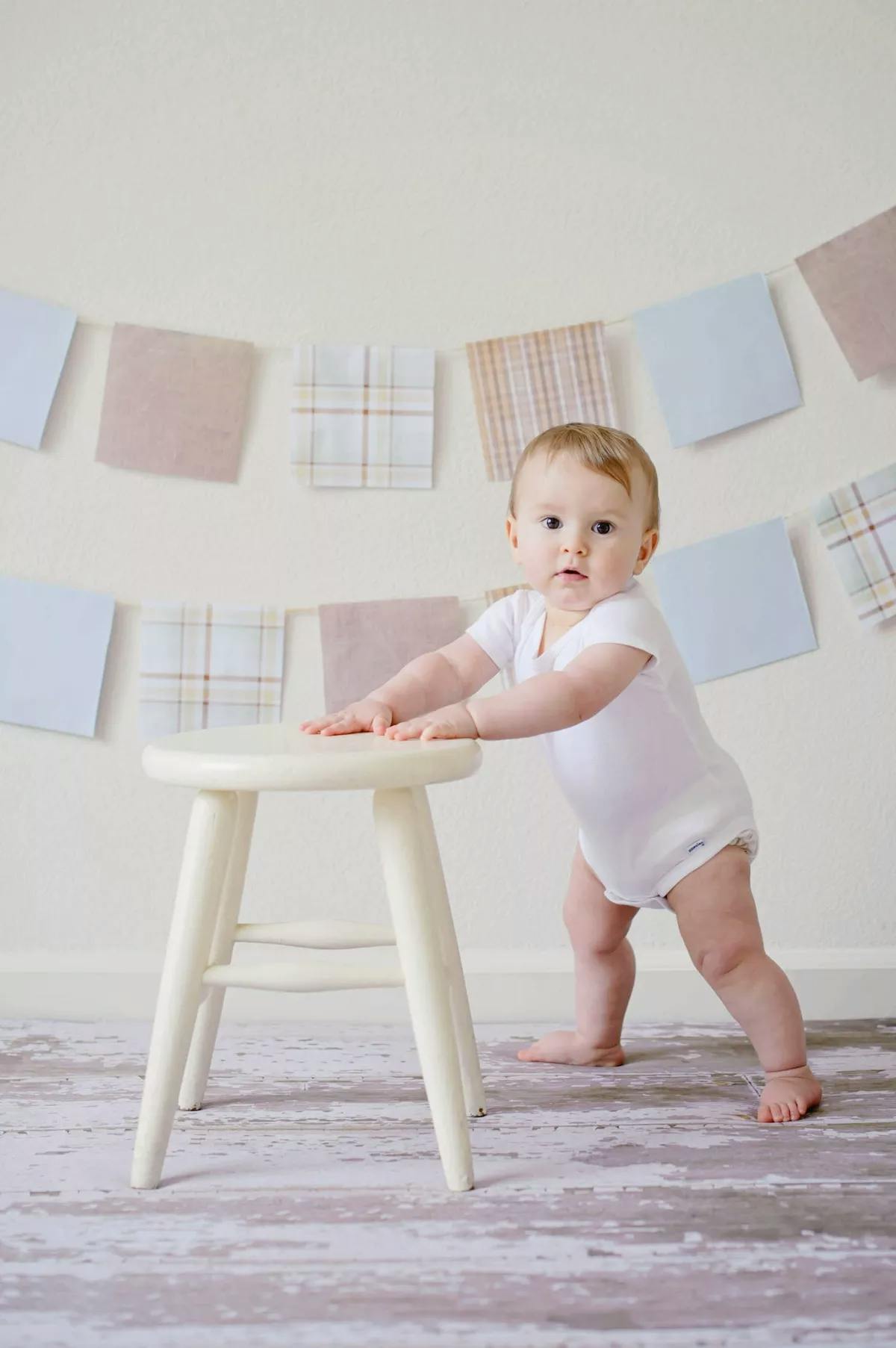 standing baby and stool
