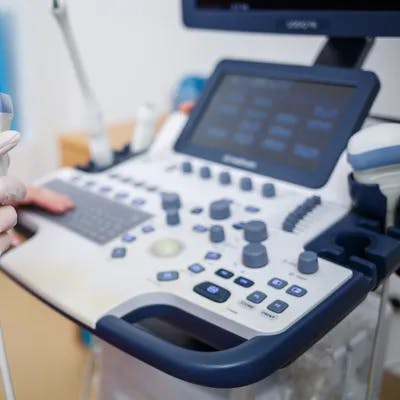 A nurse holding an internal ultrasound probe