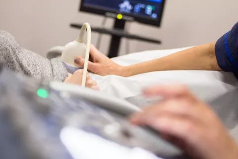 Clinician performing an ultrasound