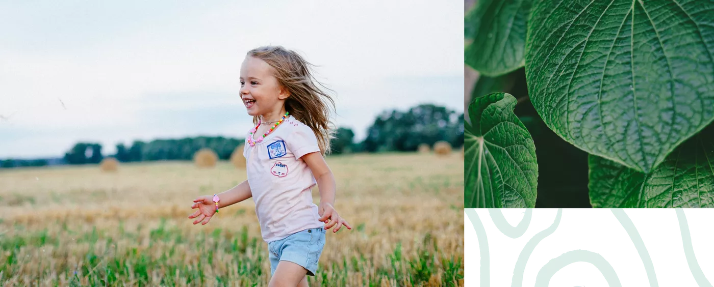 girl running on a field, plants